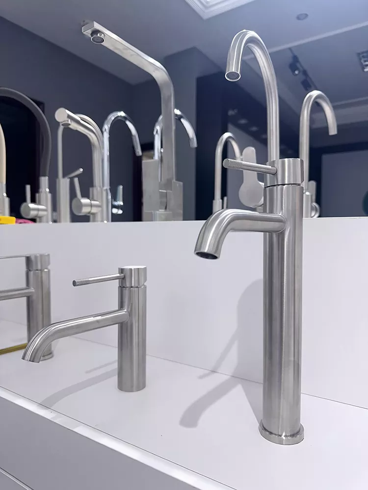 Extended curved spout knurled handle hot and cold basin faucet
